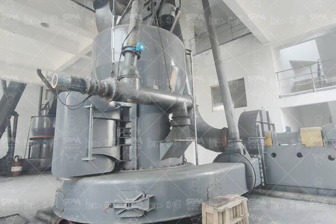 Photograph of an MTW Series Trapezium Mill installation in an industrial setting.